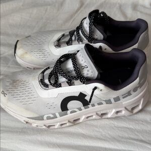 On Running White and Black Athletic Shoes